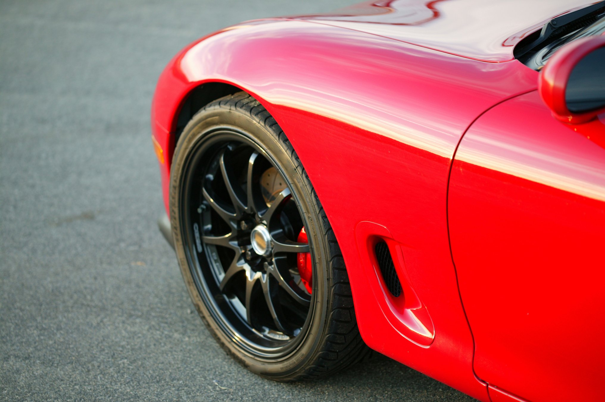 Red Mazda RX7 Sports car front wheel